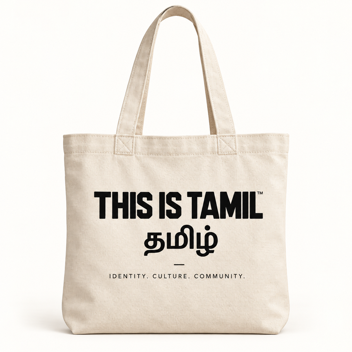 Naturfarbene THIS IS TAMIL Tote Bag mit schwarzem Aufdruck THIS IS TAMIL™, தமிழ் und IDENTITY. CULTURE. COMMUNITY.